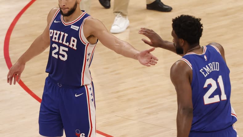 May 29, 2021; Washington, District of Columbia, USA; Philadelphia 76ers center Joel Embiid (21) celebrates with 76ers guard Ben Simmons (25) against the Washington Wizards in the third quarter during game three in the first round of the 2021 NBA Playoffs at Capital One Arena. Mandatory Credit: Geoff Burke-USA TODAY Sports