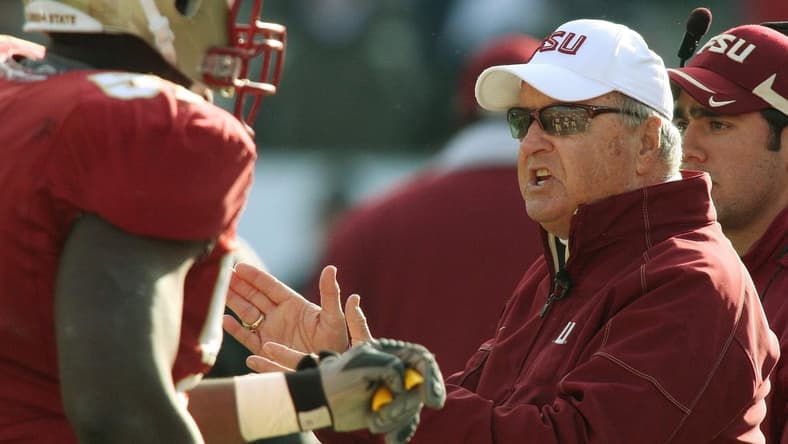 Jan. 1, 2010: Bobby Bowden congratulates his players as they leave the field following a third quarter touchdown during his final game against West Virginia at Jacksonville Municipal Stadium for the Gator Bowl. [Kelly Jordan, Florida Times-Union]