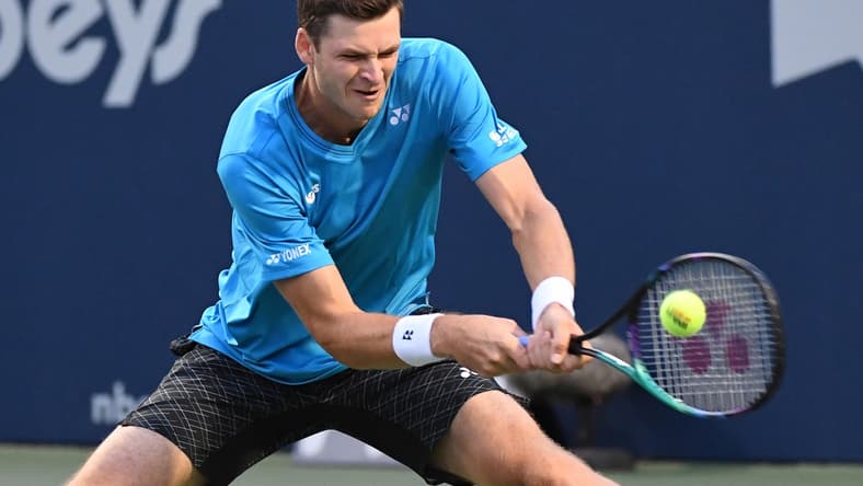 Aug 13, 2021; Toronto, Ontario, Canada; Hubert Hurkacz of Poland plays a shot against Daniil Medvedev of Russia during the quarter finals of the National Bank Open at Aviva Centre. Mandatory Credit: Dan Hamilton-USA TODAY Sports