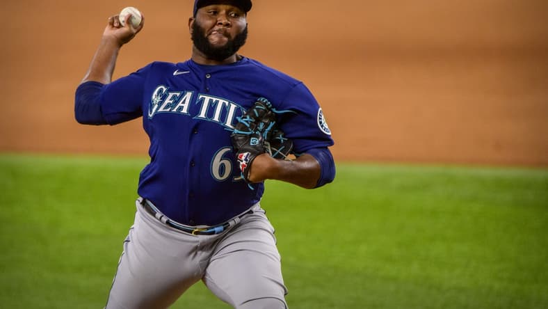 Aug 19, 2021; Arlington, Texas, USA; Seattle Mariners relief pitcher Diego Castillo (63) in action during the game between the Texas Rangers and the Seattle Mariners at Globe Life Field. Mandatory Credit: Jerome Miron-USA TODAY Sports