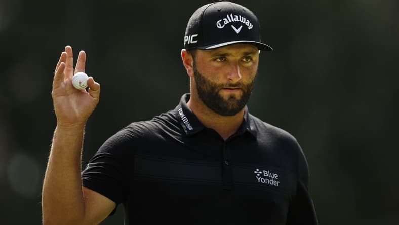 Aug 27, 2021; Owings Mills, Maryland, USA; Jon Rahm waves to fans after sinking his putt on the first hole during the second round of the BMW Championship golf tournament. Mandatory Credit: Scott Taetsch-USA TODAY Sports