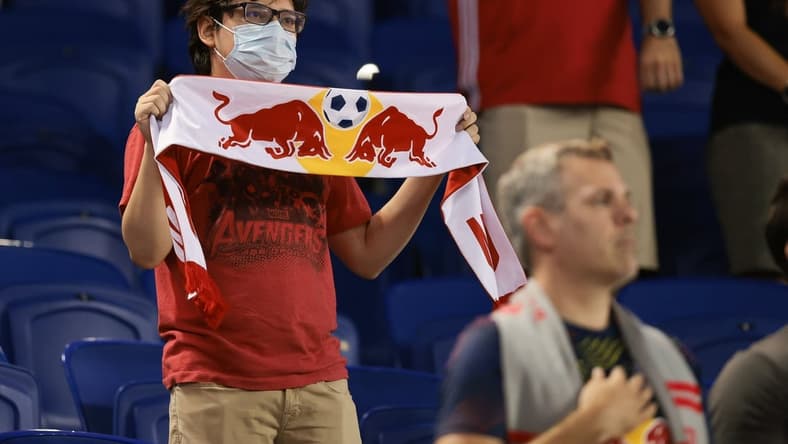 Aug 18, 2021; Harrison, New Jersey, USA; A fan holds a scarf before the game between the New York Red Bulls and the Columbus Crew at Red Bull Arena. Mandatory Credit: Vincent Carchietta-USA TODAY Sports