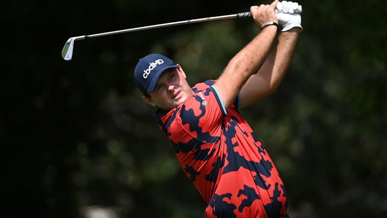 Sep 2, 2021; Atlanta, Georgia, USA; Patrick Reed plays his shot from the second tee during the first round of the Tour Championship golf tournament. Mandatory Credit: Adam Hagy-USA TODAY Sports