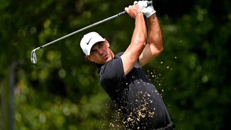 Sep 2, 2021; Atlanta, Georgia, USA; Brooks Koepka plays his shot from the second tee during the first round of the Tour Championship golf tournament. Mandatory Credit: Adam Hagy-USA TODAY Sports
