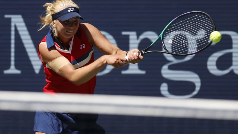 Sep 2, 2021; Flushing, NY, USA; Clara Tauson of Denmark hits a shot against Ashleigh Barty of Australia in a second round match on day four of the 2021 U.S. Open tennis tournament at USTA Billie Jean King National Tennis Center. Mandatory Credit: Jerry Lai-USA TODAY Sports