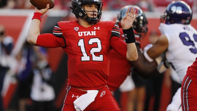 Sep 2, 2021; Salt Lake City, Utah, USA; Utah Utes quarterback Charlie Brewer (12) looks to pass against the Weber State Wildcats at Rice-Eccles Stadium. Mandatory Credit: Jeffrey Swinger-USA TODAY Sports