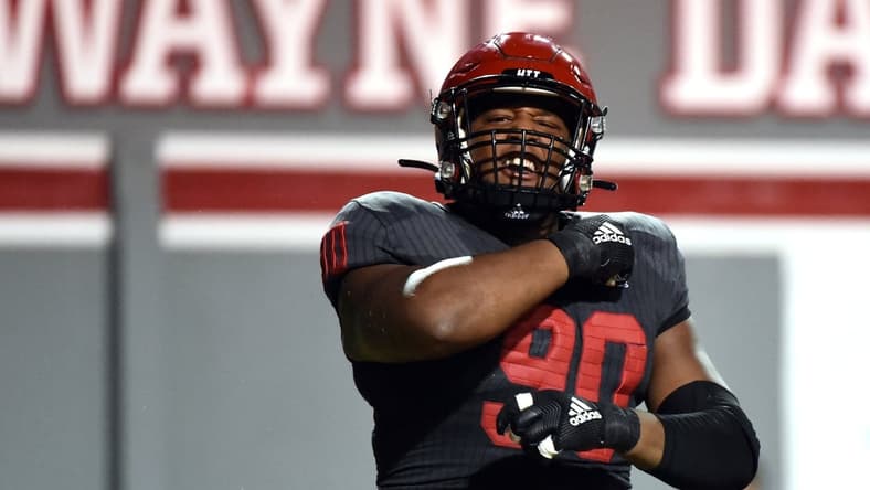 Sep 2, 2021; Raleigh, North Carolina, USA; North Carolina State Wolfpack defensive end Savion Jackson (90) reacts after a tackle against the South Florida Bulls during the second half at Carter-Finley Stadium. Mandatory Credit: Rob Kinnan-USA TODAY Sports