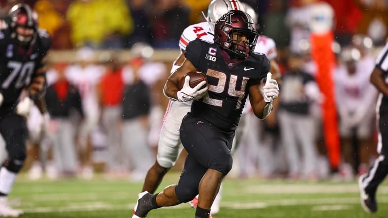 Sep 2, 2021; Minneapolis, Minnesota, USA; Minnesota Gophers running back Mohamed Ibrahim (24) runs the ball in for a touchdown during the third quarter against the Ohio State Buckeyes at Huntington Bank Stadium. Mandatory Credit: Harrison Barden-USA TODAY Sports