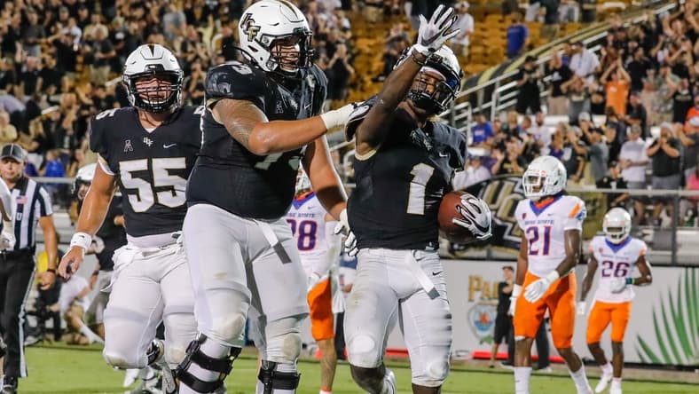 Sep 3, 2021; Orlando, Florida, USA; UCF Knights wide receiver Jaylon Robinson (1) celebrates with offensive lineman Samuel Jackson (73) after scoring a touchdown against the Boise State Broncos during the second half at Bounce House. Mandatory Credit: Mike Watters-USA TODAY Sports