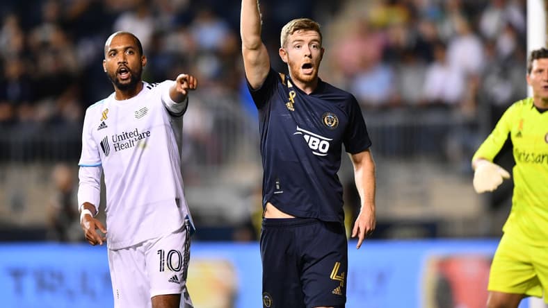 Sep 3, 2021; Philadelphia, Pennsylvania, USA; Philadelphia Union defender Stuart Findlay (4) and New England Revolution forward Teal Bunbury (10) call for a free kick in the first half at Subaru Park. Mandatory Credit: Kyle Ross-USA TODAY Sports