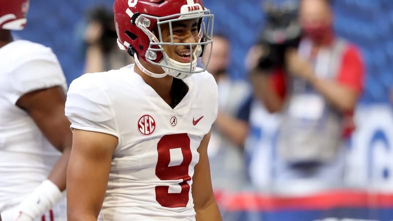 Sep 4, 2021; Atlanta, Georgia, USA; Alabama Crimson Tide quarterback Bryce Young (9) reacts after running back Trey Sanders (not pictured) scored a touchdown during the third quarter of their game against the Miami Hurricanes at Mercedes-Benz Stadium. Mandatory Credit: Jason Getz-USA TODAY Sports