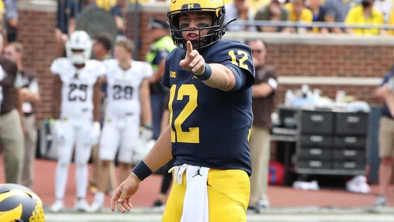 Michigan Wolverines quarterback Cade McNamara (12) signals at the line of scimmage during second half action against the Western Michigan Broncos Saturday, Sept. 4, 2021.

Mich West