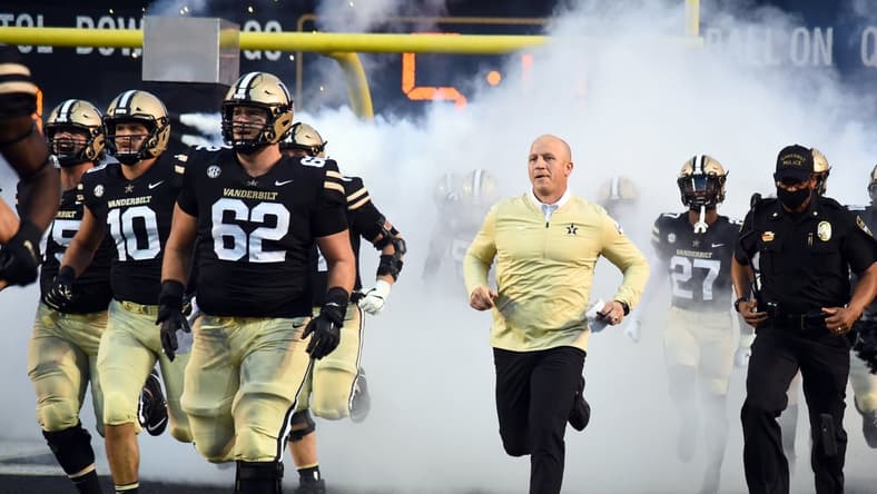 Sep 4, 2021; Nashville, Tennessee, USA; Vanderbilt Commodores head coach Clark Lea takes the field before the game against the East Tennessee State Buccaneers at Vanderbilt Stadium. Mandatory Credit: Christopher Hanewinckel-USA TODAY Sports