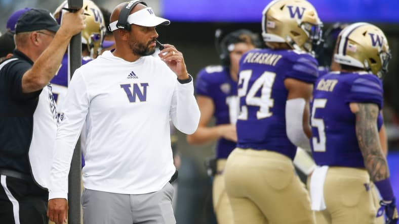 Sep 4, 2021; Seattle, Washington, USA; Washington Huskies head coach Jimmy Lake stands on the sideline during the second quarter against the Montana Grizzlies at Alaska Airlines Field at Husky Stadium. Mandatory Credit: Joe Nicholson-USA TODAY Sports
