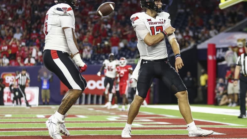 Sep 4, 2021; Houston, Texas, USA; Texas Tech Red Raiders quarterback Tyler Shough (12) reacts after rushing for a touchdown during the third quarter against the Houston Cougars at NRG Stadium. Mandatory Credit: Troy Taormina-USA TODAY Sports