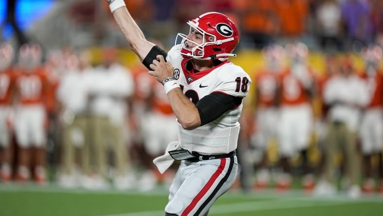 Sep 4, 2021; Charlotte, North Carolina, USA; Georgia Bulldogs quarterback JT Daniels (18) throws the ball against the Clemson Tigers during the second half at Bank of America Stadium. Mandatory Credit: Jim Dedmon-USA TODAY Sports
