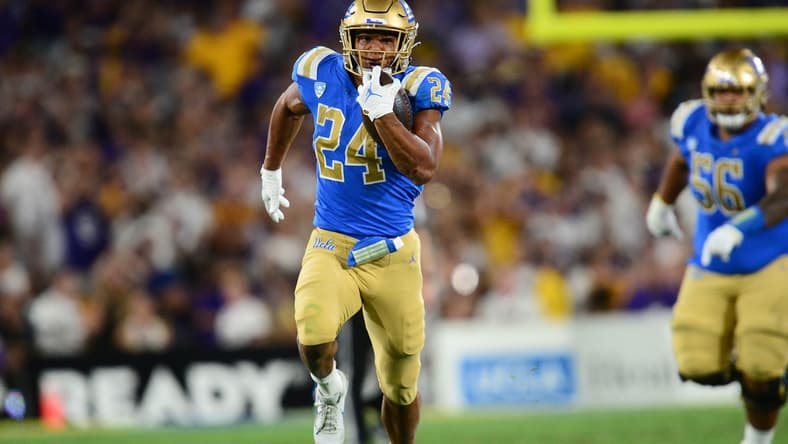 Sep 4, 2021; Pasadena, California, USA; UCLA Bruins running back Zach Charbonnet (24) runs the ball against the Louisiana State Tigers during the second half the at the Rose Bowl. Mandatory Credit: Gary A. Vasquez-USA TODAY Sports