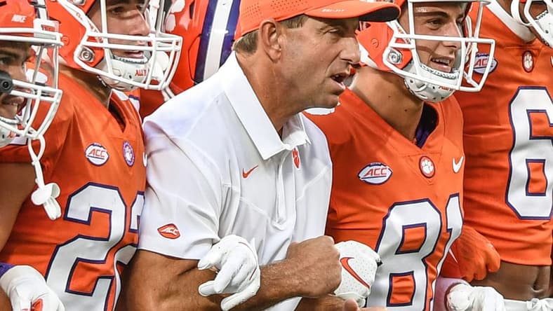 Clemson head coach Dabo Swinney is between his sons wide receiver Will Swinney(22), left, and wide receiver Drew Swinney(81) and the team for the Walk of Champions before Clemson and Georgia played in the Duke's Mayo Classic Sep 4, 2021; Charlotte, North Carolina, USA;  at Bank of America Stadium.

Ncaa Football Georgia At Clemson