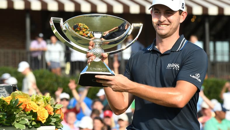 Sep 5, 2021; Atlanta, Georgia, USA; Patrick Cantlay holds up the trophy after winning the Tour Championship. Mandatory Credit: Adam Hagy-USA TODAY Sports