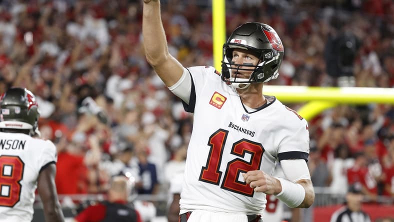 Sep 9, 2021; Tampa, Florida, USA; Tampa Bay Buccaneers quarterback Tom Brady (12) celebrates after a Buccaneers touchdown against the Dallas Cowboys during the first half at Raymond James Stadium. Mandatory Credit: Kim Klement-USA TODAY Sports