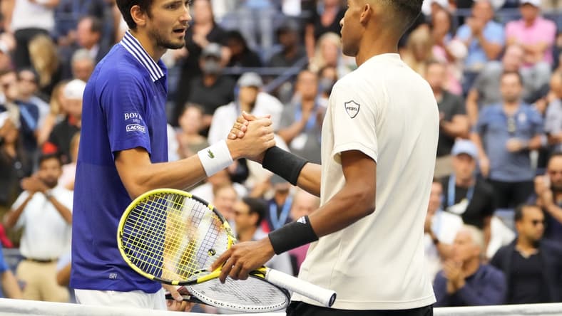 Sep 10, 2021; Flushing, NY, USA; Daniil Medvedev of Russia (L) shakes hands with Felix Auger-Aliassime of Canada (R) after their match on day twelve of the 2021 U.S. Open tennis tournament at USTA Billie Jean King National Tennis Center. Mandatory Credit: Robert Deutsch-USA TODAY Sports
