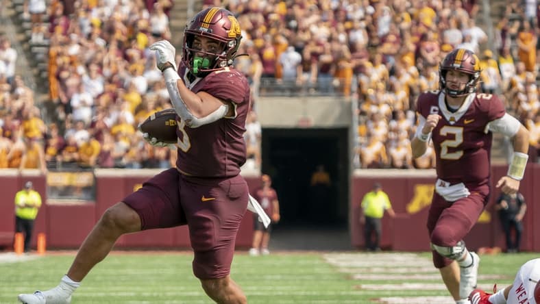 Sep 11, 2021; Minneapolis, Minnesota, USA; Minnesota Golden Gophers running back Treyson Potts (3) scores in the fourth quarter after evading Miami (OH) Redhawks defensive back Sterling Weatherford (21), Minnesota Golden Gophers quarterback Tanner Morgan (2) follows at Huntington Bank Stadium. Mandatory Credit: Matt Blewett-USA TODAY Sports