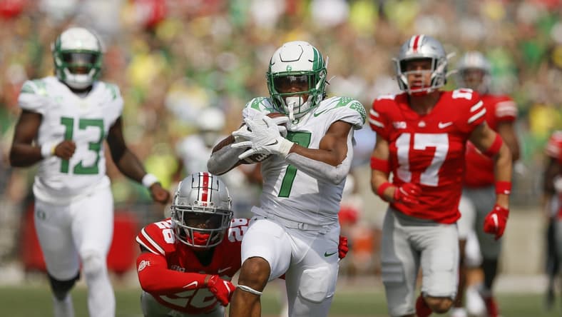 Oregon running back CJ Verdell runs past Ohio State  safety Bryson Shaw (17) and cornerback Cameron Brown (26) for a 77-yard touchdown on Saturday. Verdell scored two touchdowns.

Oregon CP