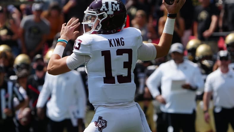 Sep 11, 2021; Denver, Colorado, USA; Texas A&M Aggies quarterback Haynes King (13) prepares to pass the ball in the first quarter against the Colorado Buffaloes at Empower Field at Mile High. Mandatory Credit: Ron Chenoy-USA TODAY Sports
