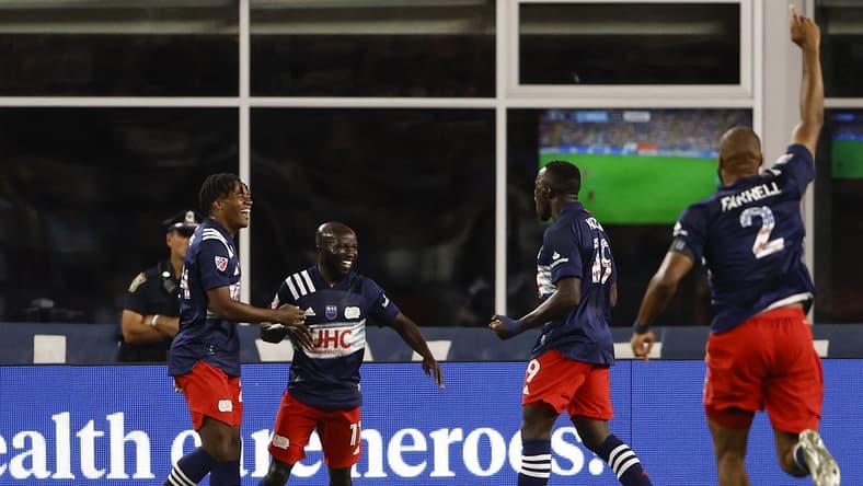 Sep 11, 2021; Foxborough, Massachusetts, USA; New England Revolution midfielder Ema Boateng (11) celebrates his goal against the New York City with forward DeJuan Jones (24) and forward Edward Kizza (19) during the first half at Gillette Stadium. Mandatory Credit: Winslow Townson-USA TODAY Sports