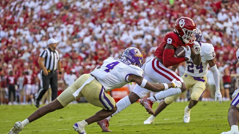 Sep 11, 2021; Norman, Oklahoma, USA; Oklahoma Sooners wide receiver Michael Woods II (8) scores a touchdown past Western Carolina Catamounts defensive back Cameron McCutcheon (4) during the second quarter at Gaylord Family-Oklahoma Memorial Stadium. Mandatory Credit: Kevin Jairaj-USA TODAY Sports