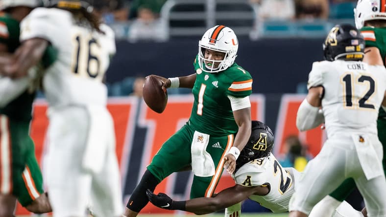 Sep 11, 2021; Miami Gardens, Florida, USA; Miami Hurricanes quarterback D'Eriq King (1) is pressured by Appalachian State Mountaineers linebacker Brendan Harrington (29) during the second quarter at Hard Rock Stadium. Mandatory Credit: Richard Graulich-USA TODAY Sports