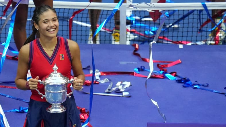 Sep 11, 2021; Flushing, NY, USA; Emma Raducanu of Great Britain celebrates with the championship trophy after her match against Leylah Fernandez of Canada (not pictured) in the women's singles final on day thirteen of the 2021 U.S. Open tennis tournament at USTA Billie Jean King National Tennis Center. Mandatory Credit: Danielle Parhizkaran-USA TODAY Sports