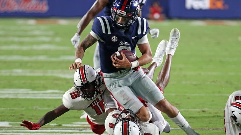 Sep 11, 2021; Oxford, Mississippi, USA; Mississippi Rebels quarterback Matt Corral (2) runs the ball against Austin Peay Governors defensive back Shamari Simmons (16) and defensive back Isaiah Norman (8) during the second quarter at Vaught-Hemingway Stadium. Mandatory Credit: Petre Thomas-USA TODAY Sports