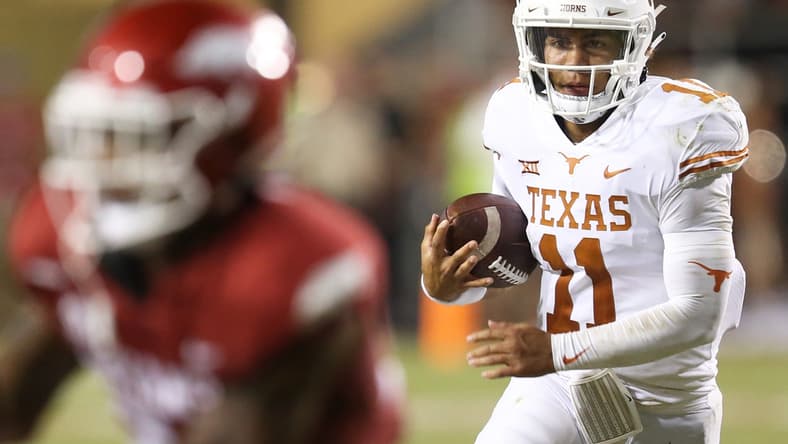 Sep 11, 2021; Fayetteville, Arkansas, USA; Texas Longhorns quarterback Casey Thompson (11) rushes in the second half against the Arkansas Razorbacks at Donald W. Reynolds Razorback Stadium. Arkansas won 40-21. Mandatory Credit: Nelson Chenault-USA TODAY Sports
