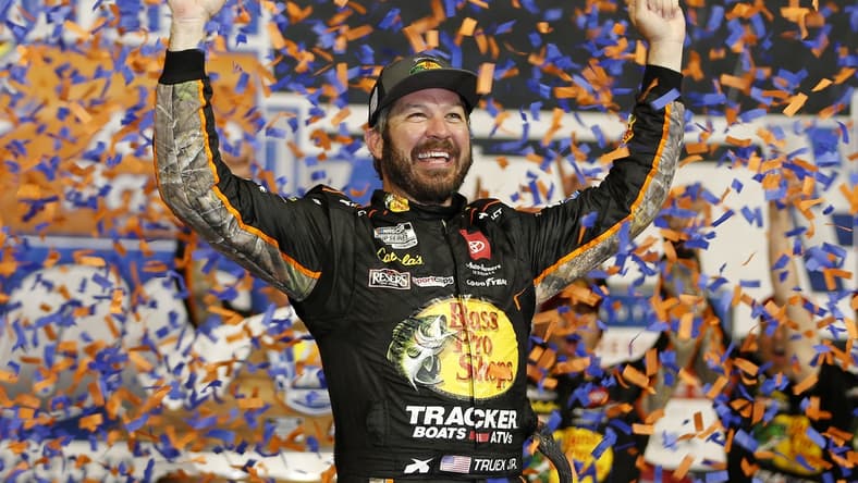 Sep 11, 2021; Richmond, Virginia, USA; NASCAR Cup Series driver Martin Truex Jr. (19) celebrates in victory lane after winning the Federated Auto Parts 400 Salute to First Responders at Richmond International Raceway. Mandatory Credit: Amber Searls-USA TODAY Sports