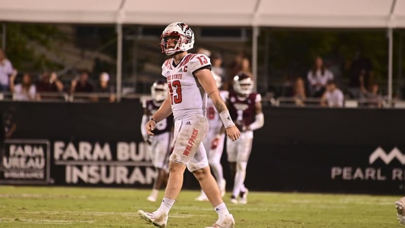 Sep 11, 2021; Starkville, Mississippi, USA; North Carolina State Wolfpack quarterback Devin Leary (13) reacts during the fourth quarter against the Mississippi State Bulldogs at Davis Wade Stadium at Scott Field. Mandatory Credit: Matt Bush-USA TODAY Sports