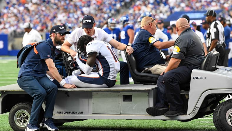 Sep 12, 2021; East Rutherford, New Jersey, USA; Denver Broncos wide receiver Jerry Jeudy (10) is taken off the field after being injured in the game against the New York Giants during the second half at MetLife Stadium. Mandatory Credit: Dennis Schneidler-USA TODAY Sports