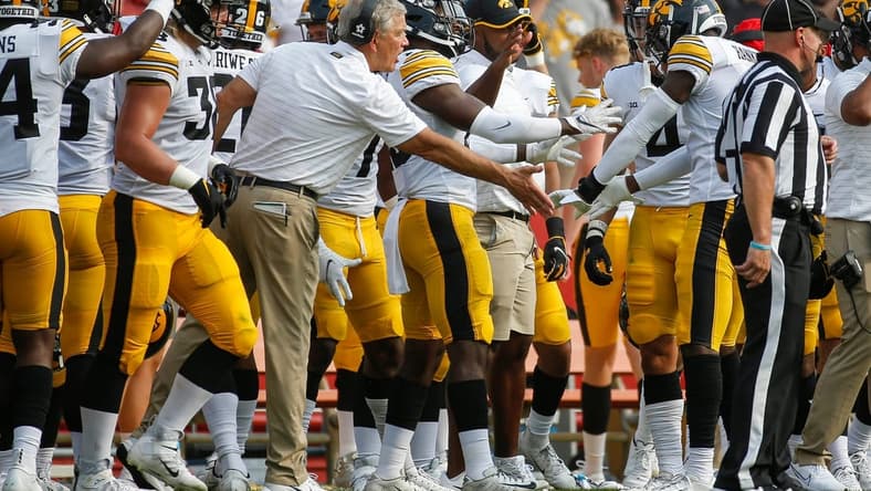 Iowa head football coach Kirk Ferentz celebrates with senior defensive back Matt Hankins after Hankins intercepted a pass from Iowa State senior quarterback Brock Purdy in the second quarter at Jack Trice Stadium in Ames on Saturday, Sept. 11, 2021.
20210911 Cyhawk
