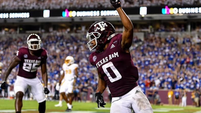 Sep 4, 2021;  College Station, Texas, USA;  Texas A&M Aggies wide receiver Ainias Smith (0) reacts after his touchdown in the fourth quarter against the Kent State Golden Flashes at Kyle Field. Mandatory Credit: Maria Lysaker-USA TODAY Sports