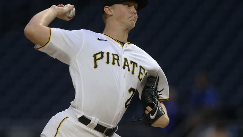 Sep 15, 2021; Pittsburgh, Pennsylvania, USA; Pittsburgh Pirates starting pitcher Mitch Keller (23) delivers against the Cincinnati Reds during the first inning at PNC Park. Mandatory Credit: Charles LeClaire-USA TODAY Sports
