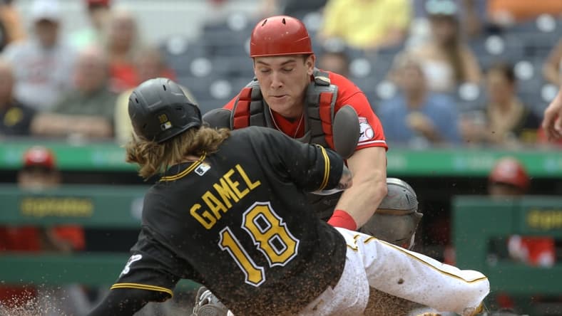 Sep 16, 2021; Pittsburgh, Pennsylvania, USA; Cincinnati Reds catcher Tyler Stephenson (37) tags Pittsburgh Pirates left fielder Ben Gamel (18) out at home plate attempting to score during the second inning at PNC Park. Mandatory Credit: Charles LeClaire-USA TODAY Sports