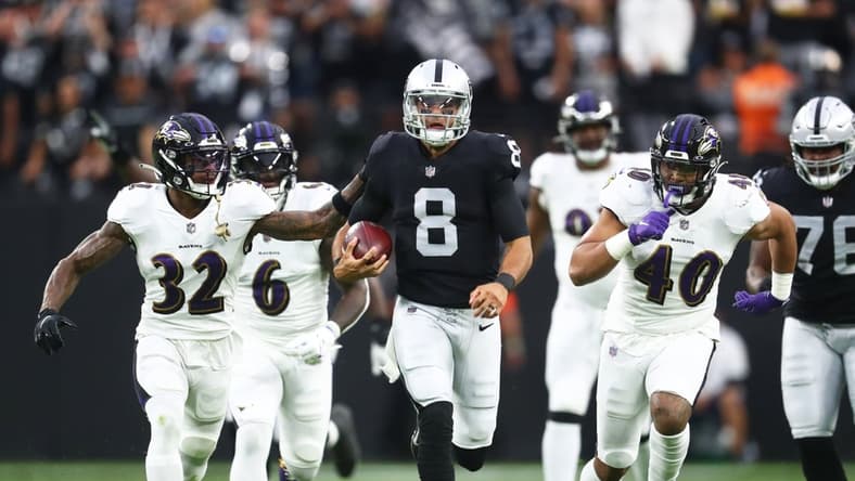 Sep 13, 2021; Paradise, Nevada, USA; Las Vegas Raiders quarterback Marcus Mariota (8) runs the ball ahead of Baltimore Ravens linebacker Patrick Queen (6) defensive back DeShon Elliott (32) and linebacker Malik Harrison (40) during the first half at Allegiant Stadium. Mandatory Credit: Mark J. Rebilas-USA TODAY Sports