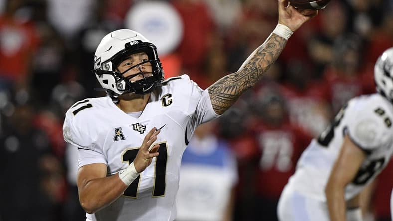 Sep 17, 2021; Louisville, Kentucky, USA; UCF Knights quarterback Dillon Gabriel (11) throws a pass against the Louisville Cardinals during the second half at Cardinal Stadium. Louisville defeated Central Florida 42-35. Mandatory Credit: Jamie Rhodes-USA TODAY Sports