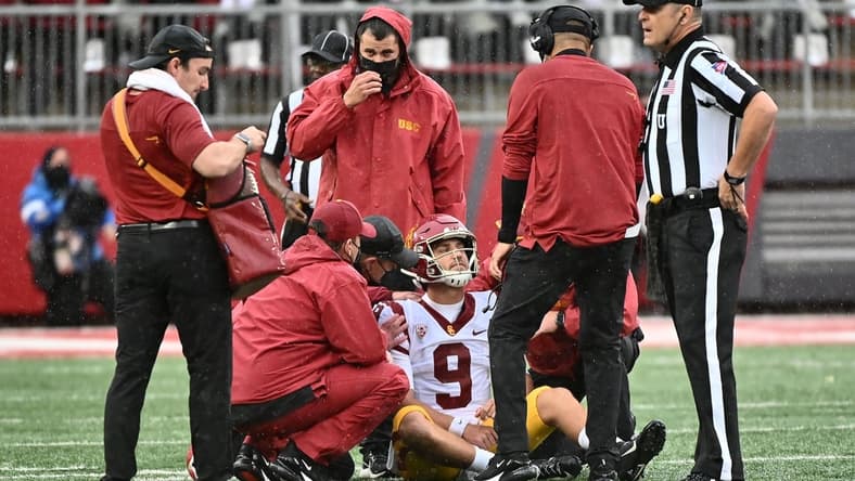 Sep 18, 2021; Pullman, Washington, USA; USC Trojans quarterback Kedon Slovis (9) is checked out by medical staff during a game against the Washington State Cougars in the first half at Gesa Field at Martin Stadium. Mandatory Credit: James Snook-USA TODAY Sports