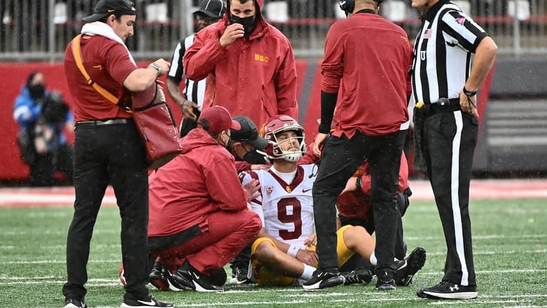 Sep 18, 2021; Pullman, Washington, USA; USC Trojans quarterback Kedon Slovis (9) is checked out by medical staff during a game against the Washington State Cougars in the first half at Gesa Field at Martin Stadium. Mandatory Credit: James Snook-USA TODAY Sports