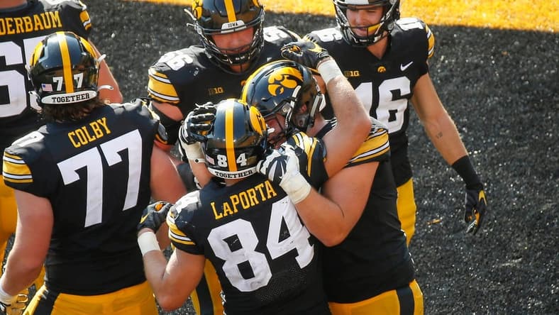 Members of the Iowa Hawkeyes football team celebrate after junior tight end Sam LaPorta scored a touchdown with seconds to go in the second quarter against Kent State at Kinnick Stadium in Iowa City on Saturday, Sept. 18, 2021.

20210918 Iowavskentstate