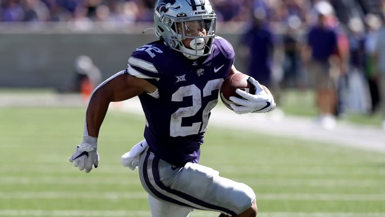 Sep 18, 2021; Manhattan, Kansas, USA; Kansas State Wildcats running back Deuce Vaughn (22) carries the ball during the fourth quarter against the Nevada Wolf Pack at Bill Snyder Family Football Stadium. Mandatory Credit: Scott Sewell-USA TODAY Sports