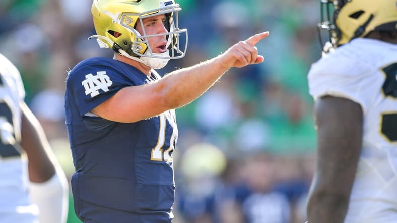 Sep 18, 2021; South Bend, Indiana, USA; Notre Dame Fighting Irish quarterback Jack Coan (17) signals in the fourth quarter against the Purdue Boilermakers at Notre Dame Stadium. Mandatory Credit: Matt Cashore-USA TODAY Sports
