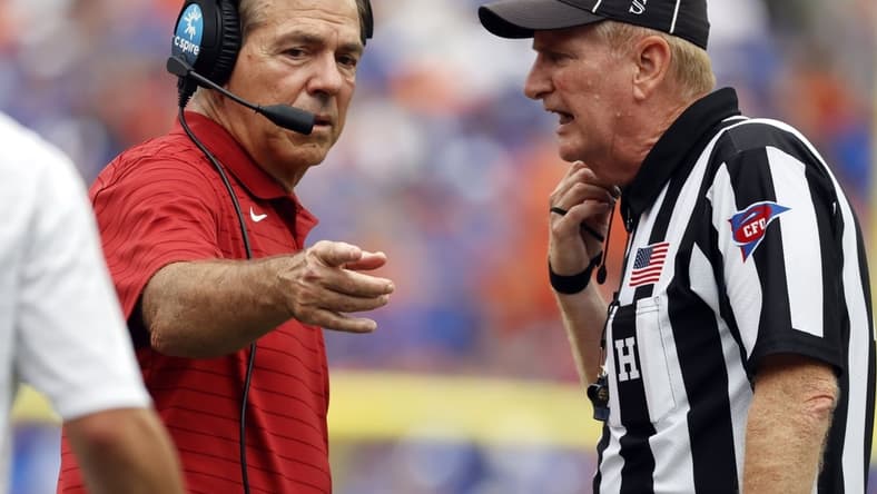 Sep 18, 2021; Gainesville, Florida, USA; Alabama Crimson Tide head coach Nick Saban talks to the referee against the Florida Gators during the second half at Ben Hill Griffin Stadium. Mandatory Credit: Kim Klement-USA TODAY Sports