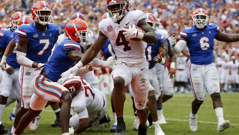 Sep 18, 2021; Gainesville, Florida, USA;  Alabama running back Brian Robinson Jr. (4) runs around Florida defenders for a touchdown at Ben Hill Griffin Stadium. Alabama defeated Florida 31-29. Mandatory Credit: Gary Cosby-USA TODAY Sports